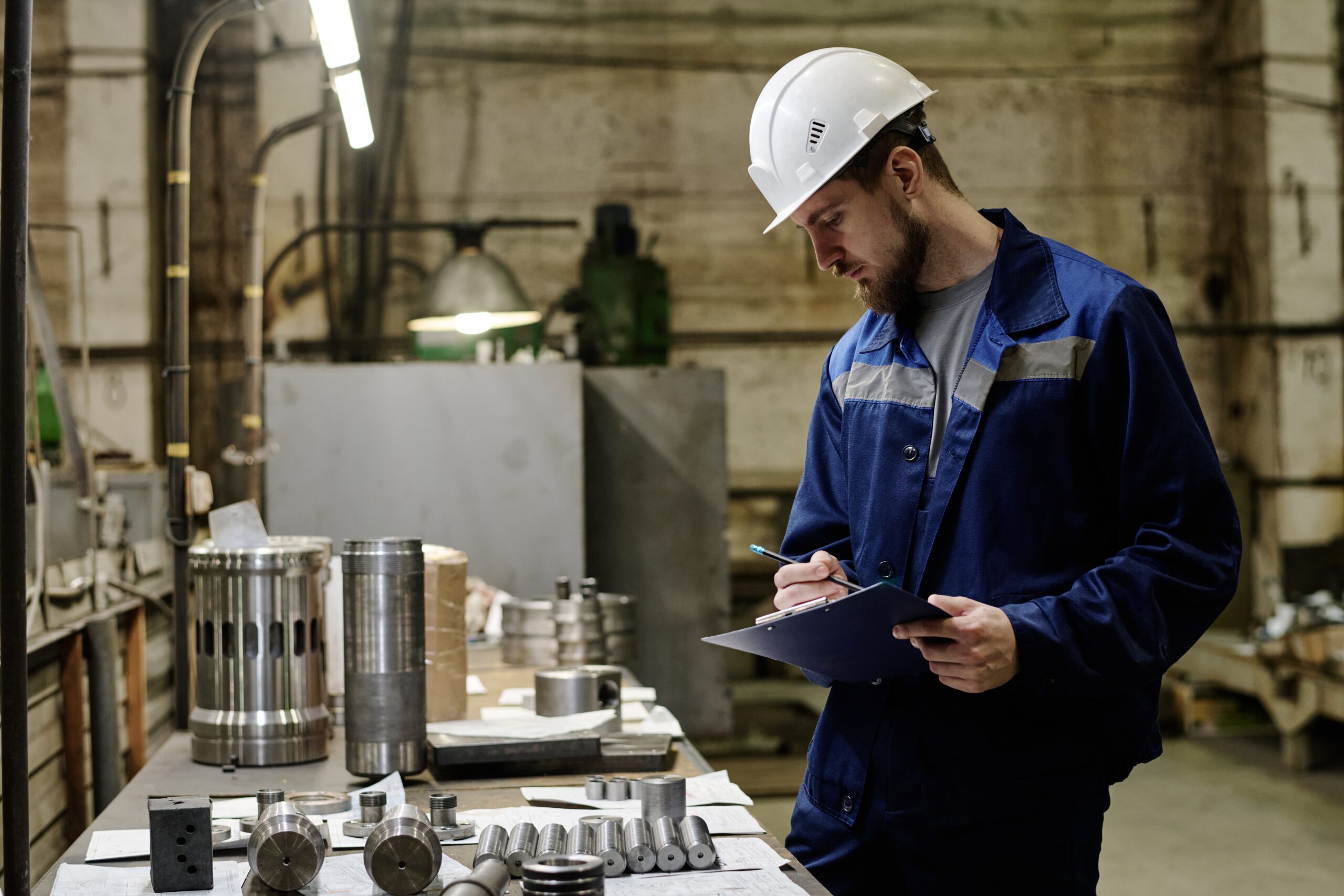 man-checking-quality-produced-parts