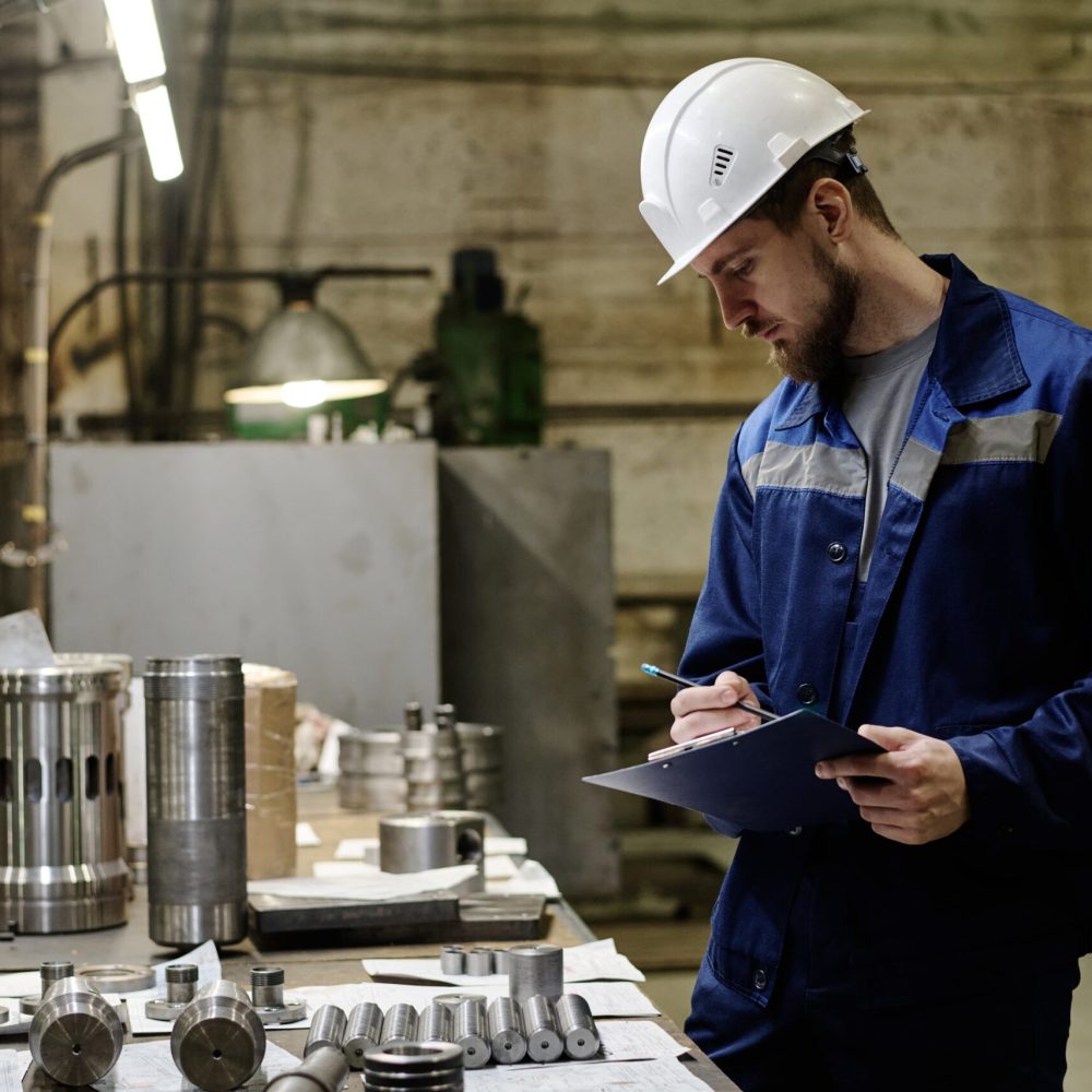 man-checking-quality-produced-parts man-checking-quality-produced-parts